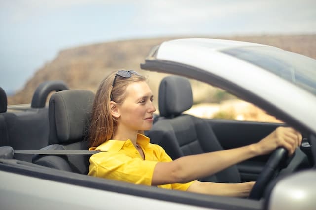 Australian women driving an open top car