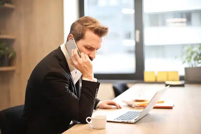 man on the phone switching car insurance providers due to poor customer service