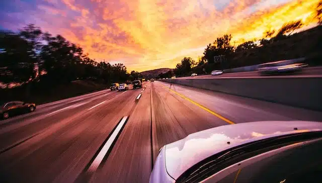 car drives along highway
