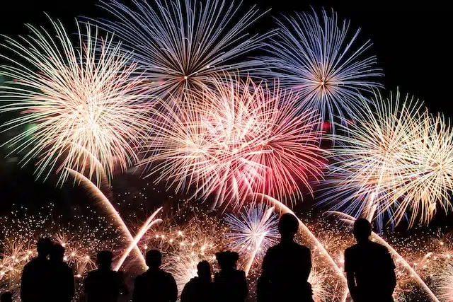 People looking at a fireworks display