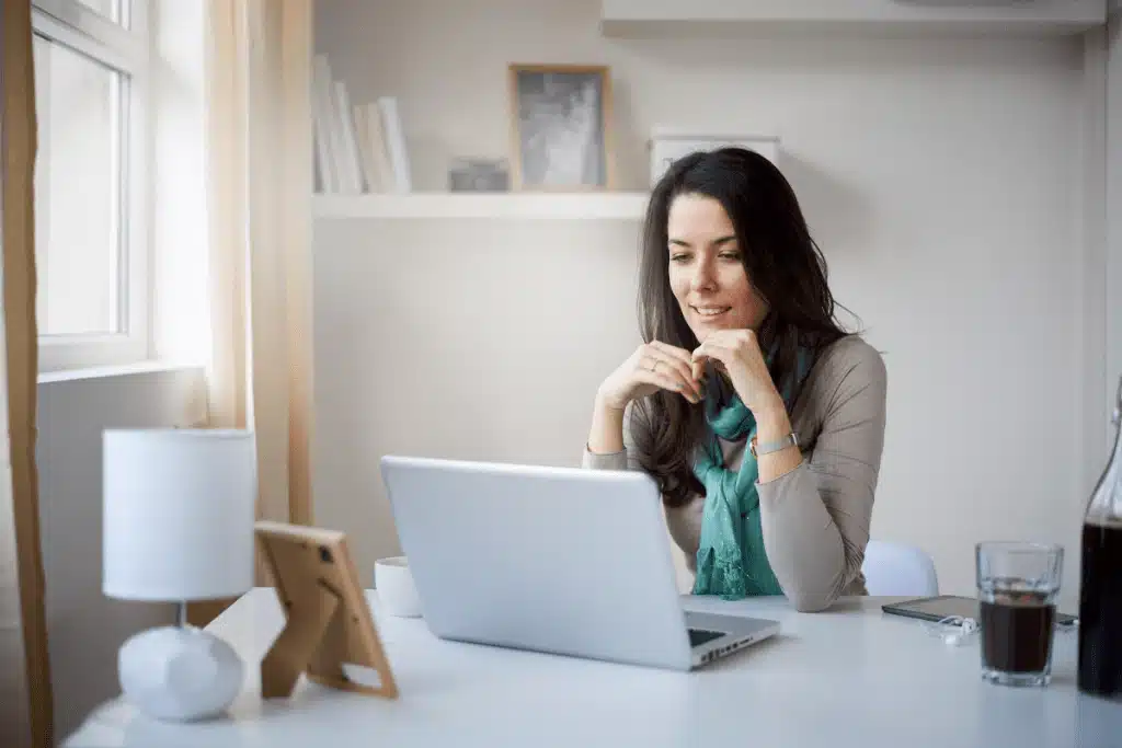 A woman spends time doing online research from home.