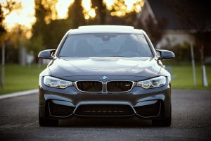 grey bmw on grey road - not a safe car colour