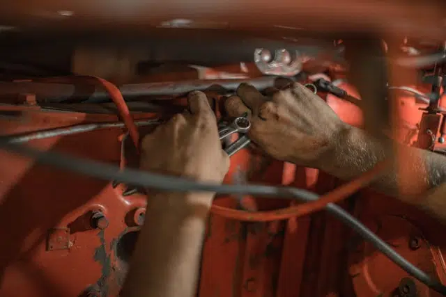 mechanic hands working on car