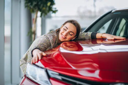 This woman loves her car so much she is hugging it