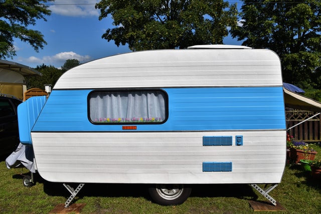 caravan parked and set up at travel site on grass