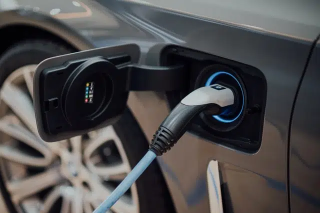 this is an electric car being charged. Electric cars are very green cars with no emissions