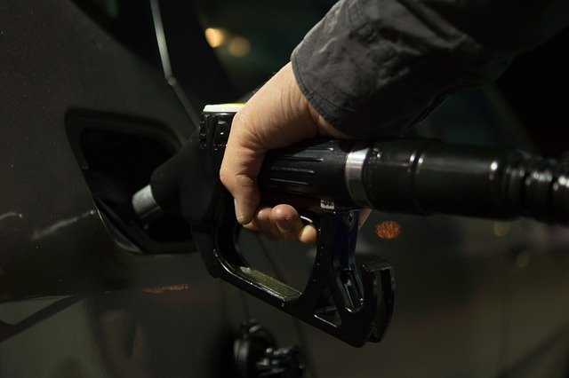 this man is adding fuel to his car
