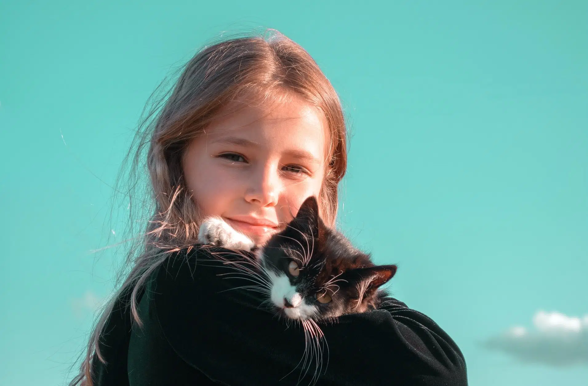 little girl celebrates national cat day with her pet cat