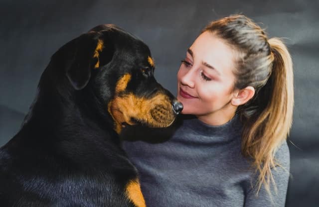 women with her pet rottweiler