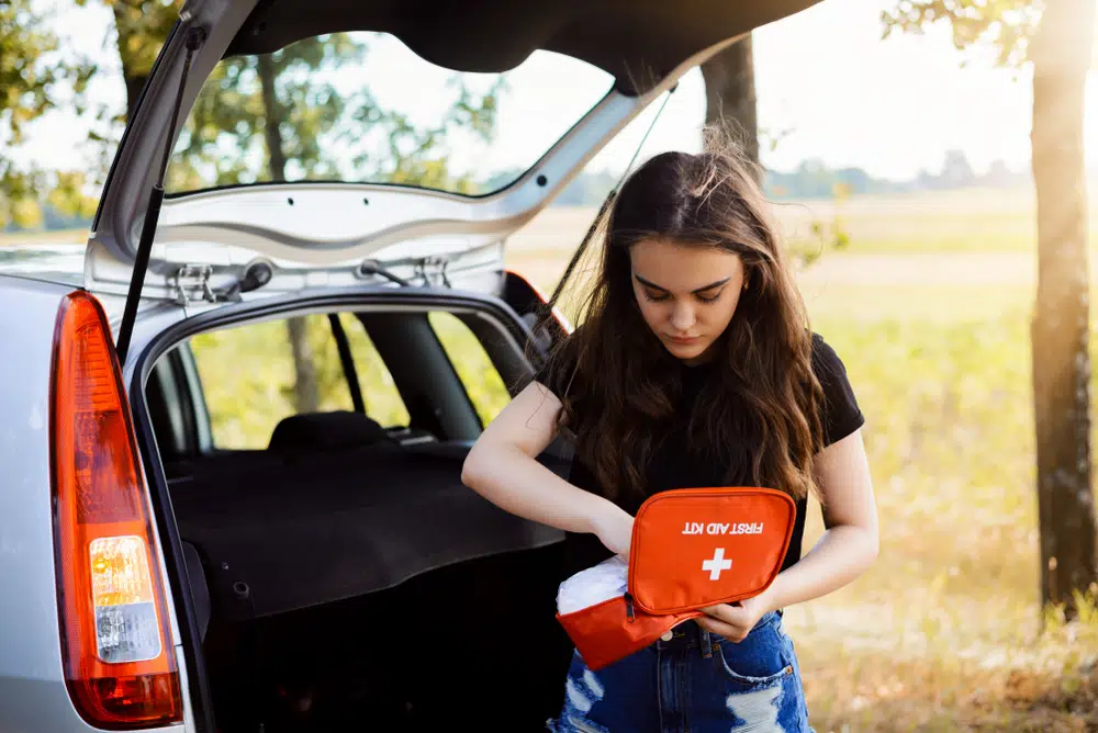 driver checks their car survival kit supplies