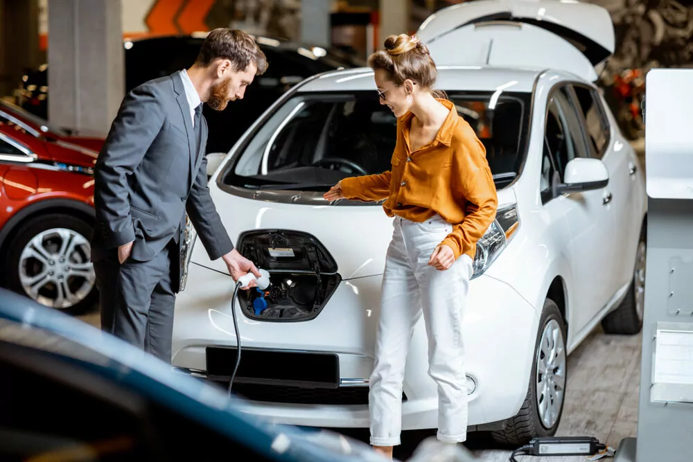 potential buyer finds out about electric cars in Australia at the EOFY car sales