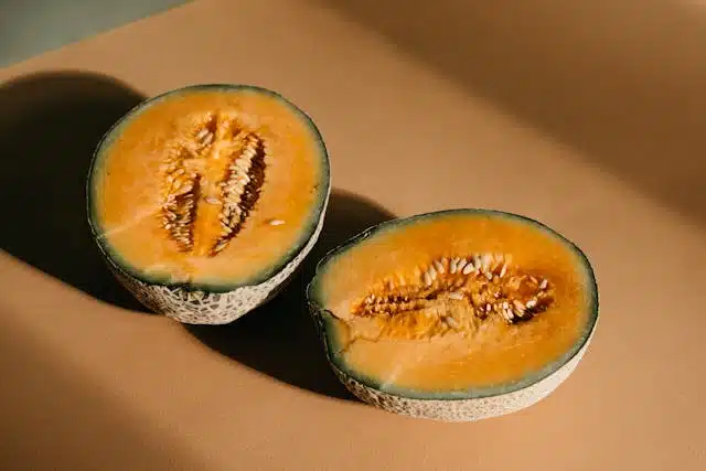 Two halves of a ripe rockmelon
