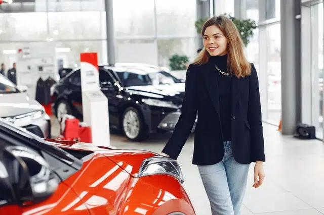 A woman buys the best car to limit contribution to global warming