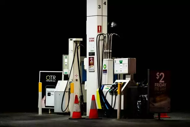 photo of lit up BP pump at petrol fuel station at night in Australia