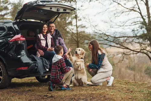 family on a car trip stop off