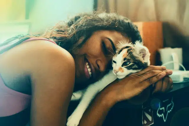 Aussie girl celebrates Hug Your Cat Day with her newly adopted kitten