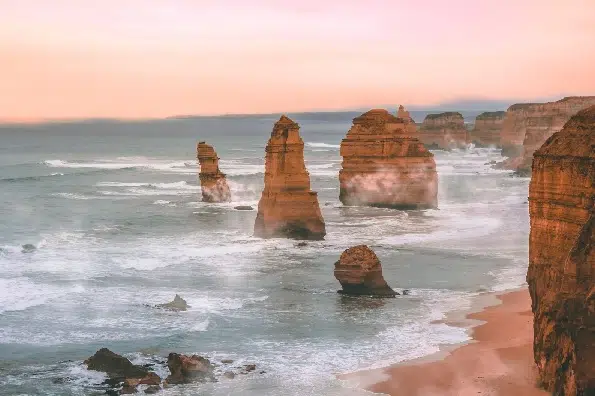 This image shows the ocean with interesting rocks that you might see on a winter road trip vacation.