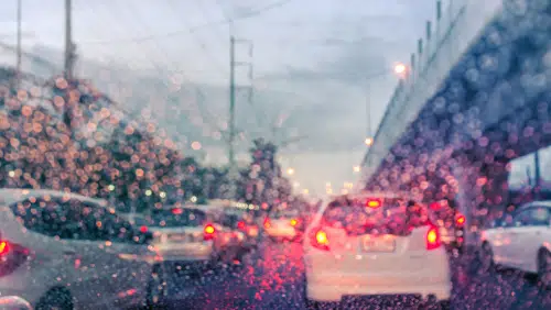 cars driving in wet weather on highway