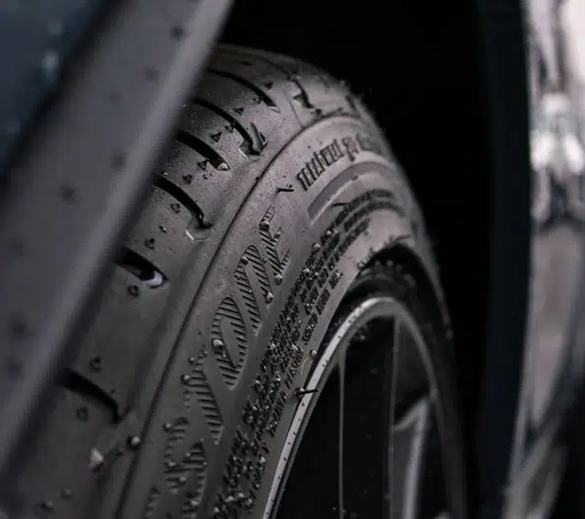 close up of car tyre in wet winter rain