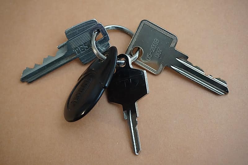 A set of traditional car keys that may be needed by an auto locksmith for a car key replacement