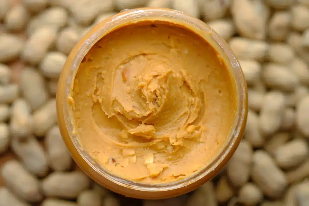 This peanut butter in a jar is a choking hazard to cats due to its thick and sticky texture.