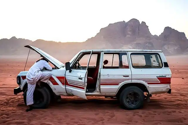 a mechanic does several checks on a 4-wheel drive vehicle to see how long the car battery lasts for