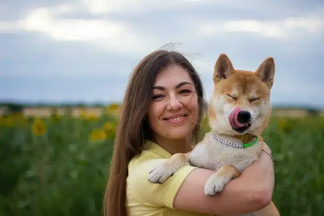 a women holds her dog who is her pride and joy