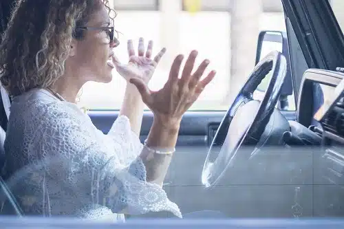 Angry woman driver shouting in the traffic. Is she from a state with Australia's worst drivers?