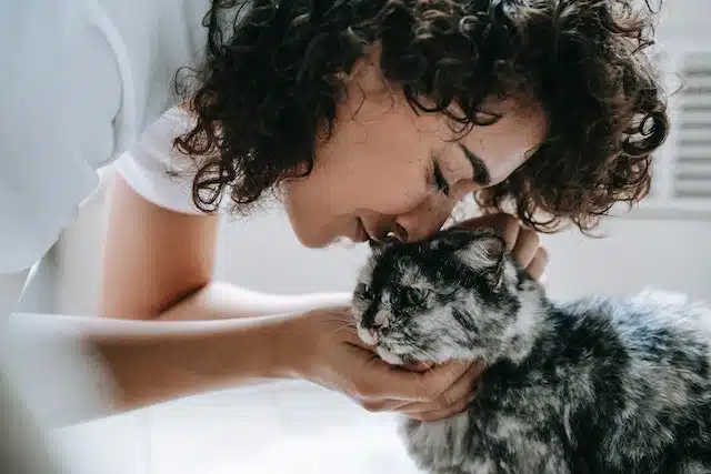 cat mum celebrates Pet Mother's Day with her purring feline friend