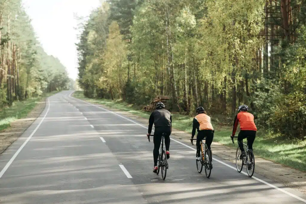 These three cyclists must not ride on a length of road where a Road Access sign is. This is one of the Australian road rules.