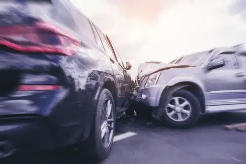 Two cars were involved in a head-on collision, with visible damage to the front ends. After the car crash, immediate steps need to be taken, including considering car towing services and understanding what to do after a car accident for safety and documentation purposes.