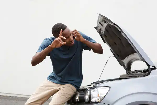 Young guy calls for help with by broken down car.