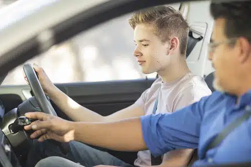 Learner driver with instructor in car. You can get car insurance for learners permit holders