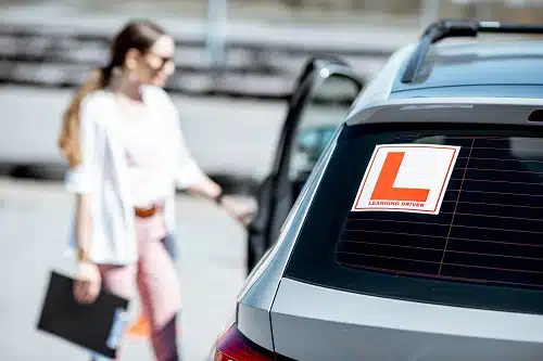 Learning sign on the car with woman driver You can get car insurance for learners permit holders