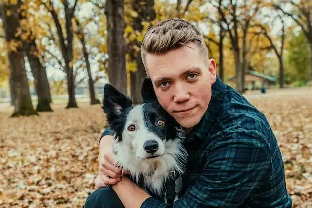 A man hugs his Border Collie best bud
