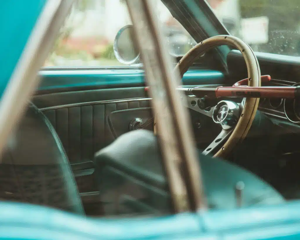 a steering wheel lock like this one in an old car will help prevent your car being stolen