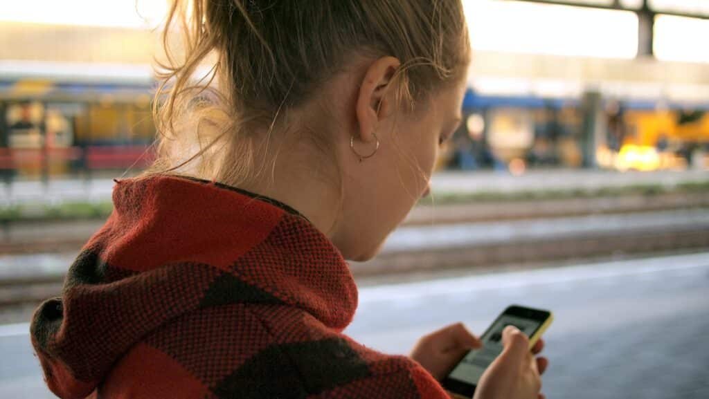 a woman uses her phone to navigate to a destination