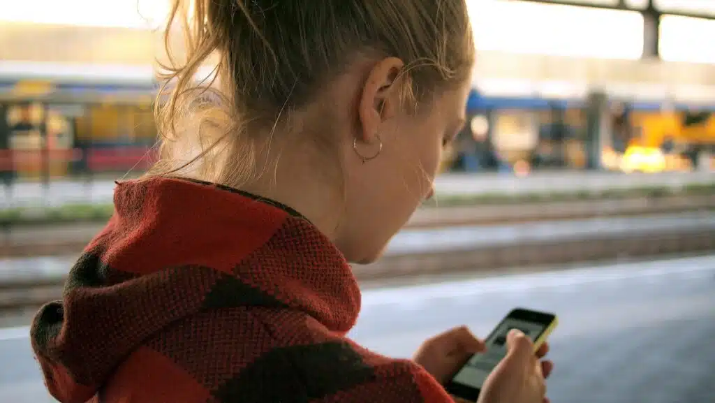a woman uses her phone to navigate to a destination