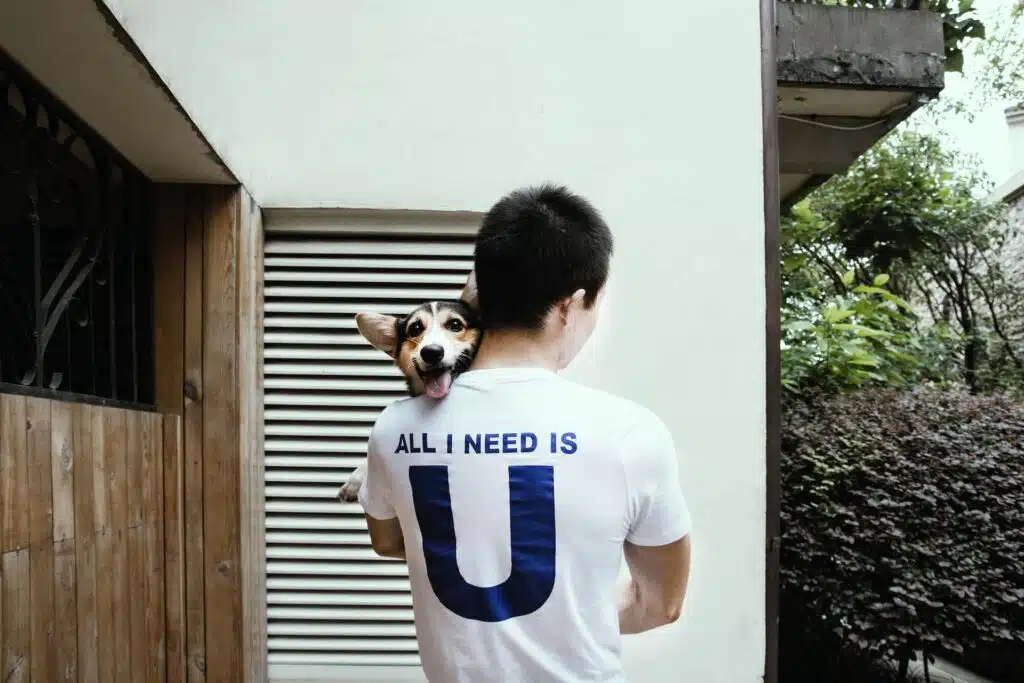 A man holds his best bud - which he bought from ethical puppy breeders