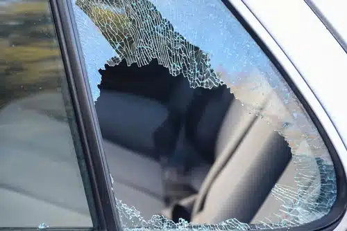 broken passenger window car smashed by a thief. In this blog we talk about contents and car insurance