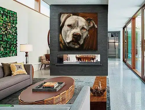 A modern living room designed for pet lovers showcases a large dog portrait above the fireplace.