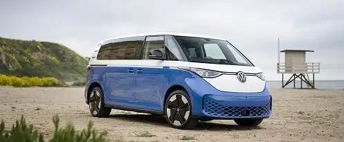 The Volkswagen e-car, one of the best new cars of 2024, is parked on the beach.