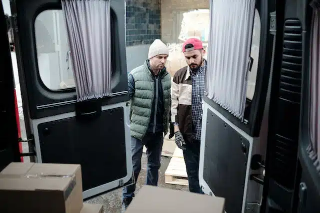 A man is viewing a used car he's considering buying
