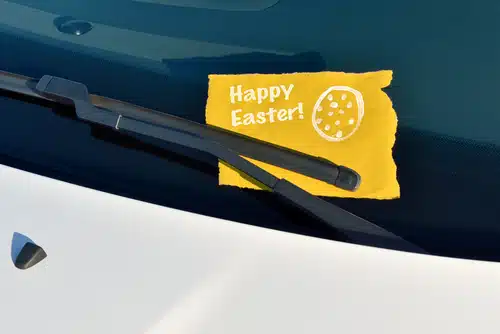 A festive easter note on the windshield of a car, spreading joy during Easter celebrations.