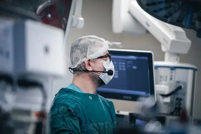 An animal surgeon in an operating room performing a surgical procedure on a pet