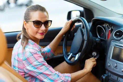 Sporting sleek sunglasses, the woman sat in her car, turning the ignition key with confidence. She knew her comprehensive car insurance had her covered, ensuring every journey was as smooth as the drive itself.